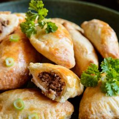 Traditional Empanadas stuffed with minced beef, pepper and corn, served with Aji Picante sauce